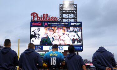 Players and fans stand for a moment of silence for NHL player Johnny Gaudreau who passed away the night before the game between the Philadelphia Phillies and the Atlanta Braves at Citizens Bank Park in Philadelphia