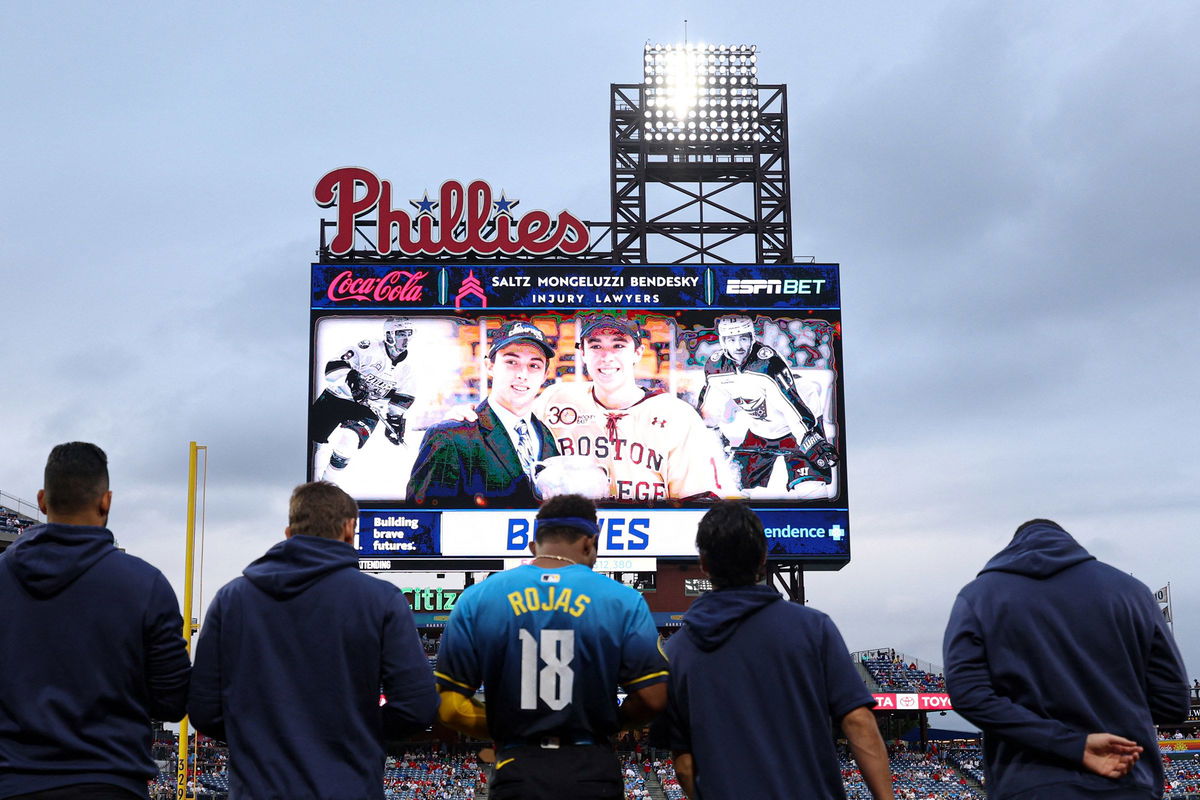 <i>Bill Streicher/USA Today Sports/Reuters via CNN Newsource</i><br />Players and fans stand for a moment of silence for NHL player Johnny Gaudreau who passed away the night before the game between the Philadelphia Phillies and the Atlanta Braves at Citizens Bank Park in Philadelphia