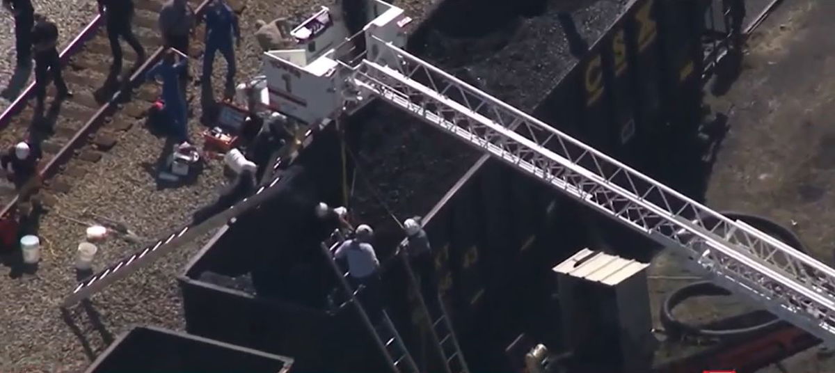 <i>WCVB via CNN Newsource</i><br/>A worker was rescued on September 3 after being trapped for hours in a train car that was carrying coal in Bridgewater