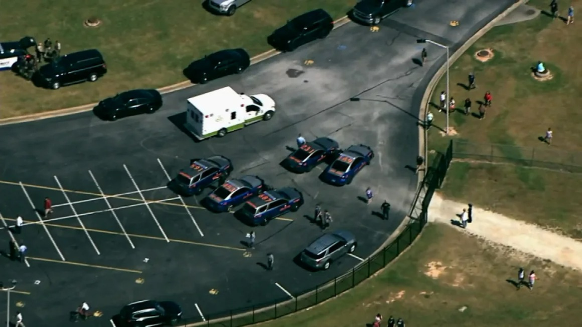 Georgia State Police vehicles are seen at Apalachee High School in Winder on Wednesday. WXIA