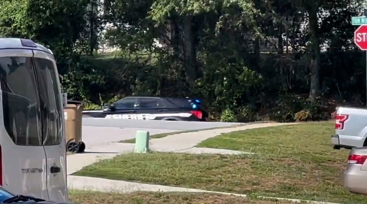 Law enforcement vehicles race over to Apalachee High School in Winder, Georgia, to respond to a shooting.