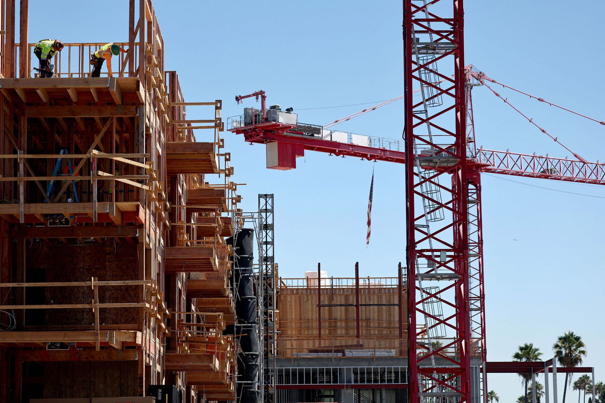 <i>Mario Tama/Getty Images via CNN Newsource</i><br/>Construction continues on a mixed-use apartment complex in Los Angeles in August.