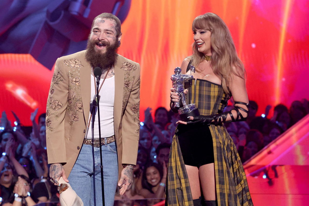 <i>Mike Coppola/Getty Images via CNN Newsource</i><br/>Post Malone and Taylor Swift accept the Best Collaboration award for 