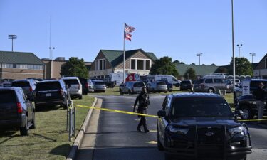 Measures are taken by security forces on the scene of a mass shooting at Apalachee high school in Winder