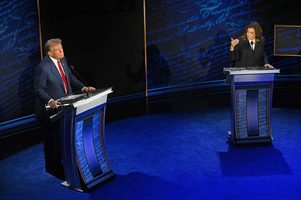 <i>Saul Loeb/AFP/Getty Images via CNN Newsource</i><br/>Vice President and Democratic presidential candidate Kamala Harris speaks as former President and Republican presidential candidate Donald Trump listens during a presidential debate at the National Constitution Center in Philadelphia