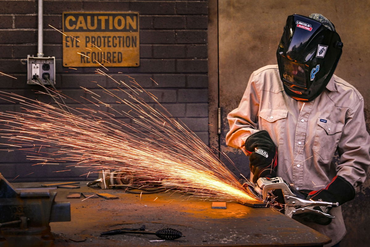 <i>John Amis/AP via CNN Newsource</i><br/>A student works during a welding class at Tennessee College of Applied Technology Nashville. From 2019 to 2024