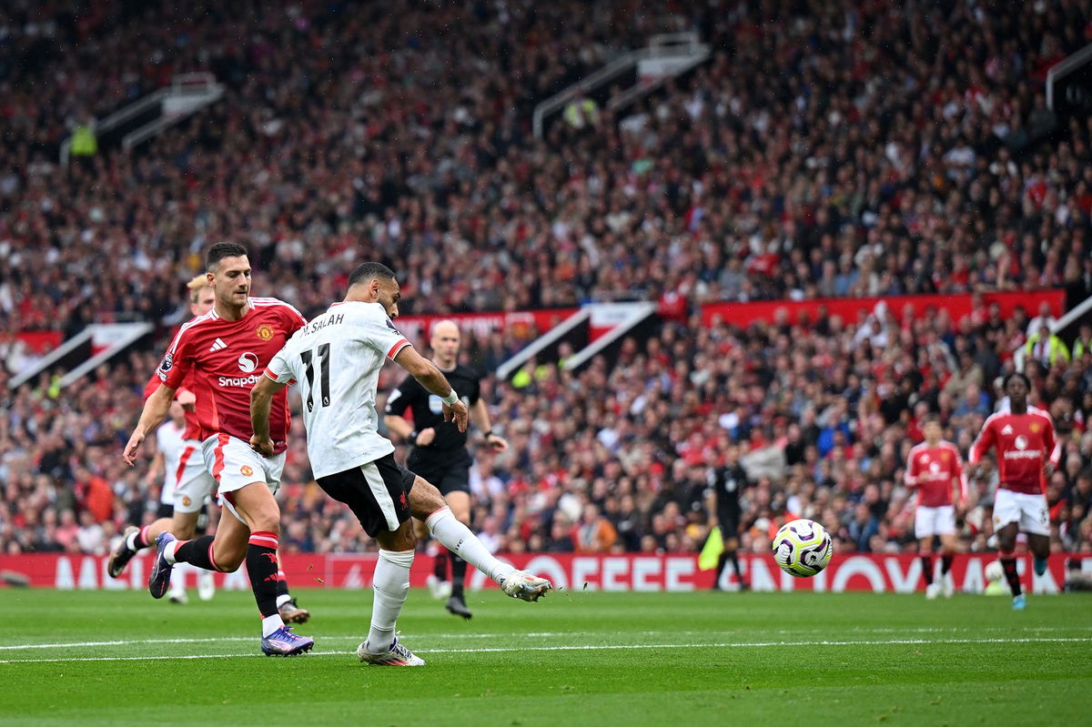 <i>Michael Regan/Getty Images via CNN Newsource</i><br/>Mohamed Salah scores Liverpool's third goal against Manchester United.