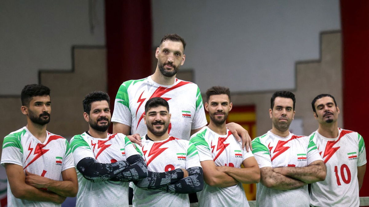 <i>Atta Kenare/AFP/Getty Images via CNN Newsource</i><br/>Morteza Mehrzadselakjani (top center) poses for a picture with his Iranian teammates during a training session of the men's sitting volleyball team ahead of the 2024 Paralympics Paris Games.