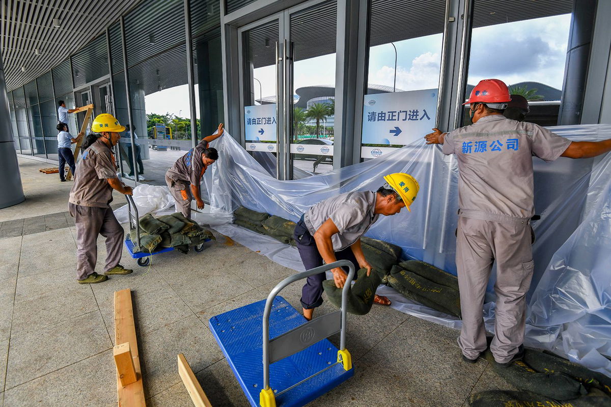 <i>Li Zhihua/China News Service/VCG/Getty Images via CNN Newsource</i><br/>Windows and doors are taped as Hong Kong braces for the arrival of Typhoon Yagi.