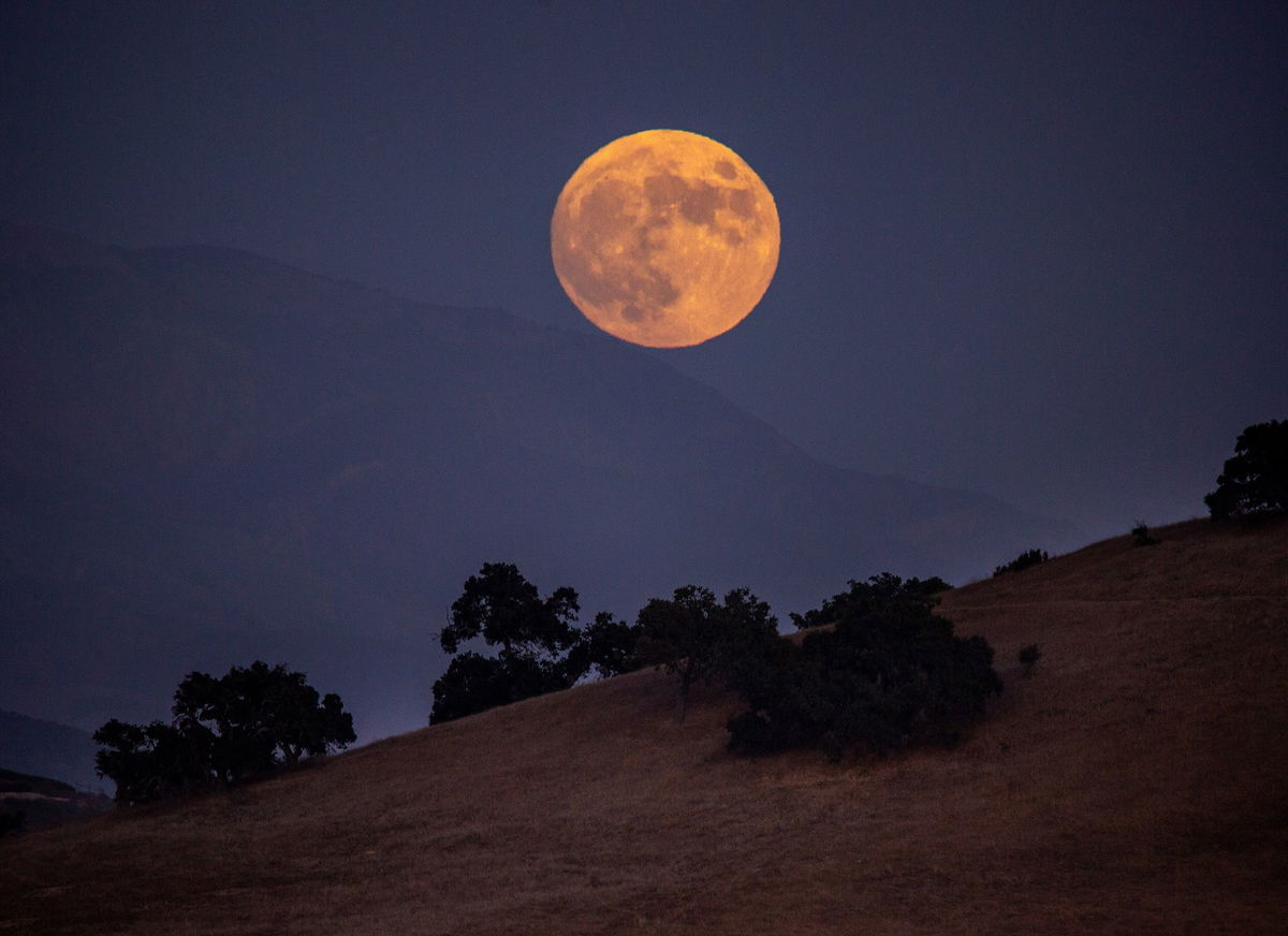 A super harvest moon is viewed along Armour Ranch Road on September 29, 2023, near Santa Ynez, California.