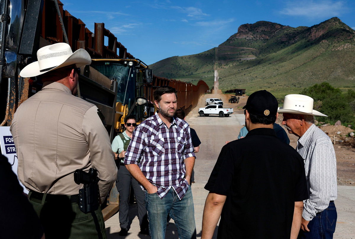 Sen. JD Vance talks with Sheriff Robert Watkins of Cochise County, President of the National Border Patrol Council while touring the U.S. Border Wall on Aug. 1 in Montezuma Pass, Arizona.