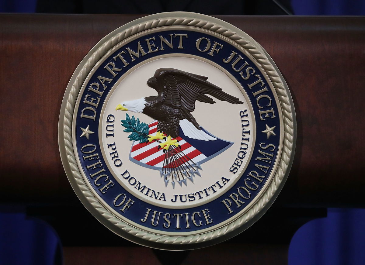 <i>Mark Wilson/Getty Images via CNN Newsource</i><br/>The Justice Department seal is seen on the lectern during a Hate Crimes Subcommittee summit on June 29