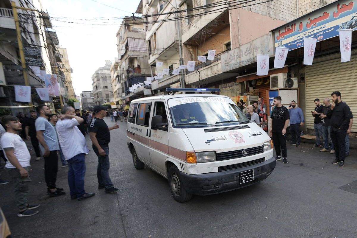 <i>Bilal Hussein/AP via CNN Newsource</i><br/>An ambulance drives through a southern suburb of Beirut after explosions were heard.