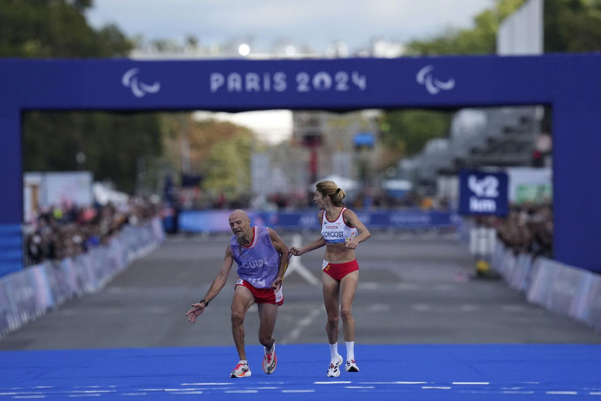 <i>Thibault Camus/AP via CNN Newsource</i><br/>Japan's Misato Michishita poses with her bronze medal after the race.