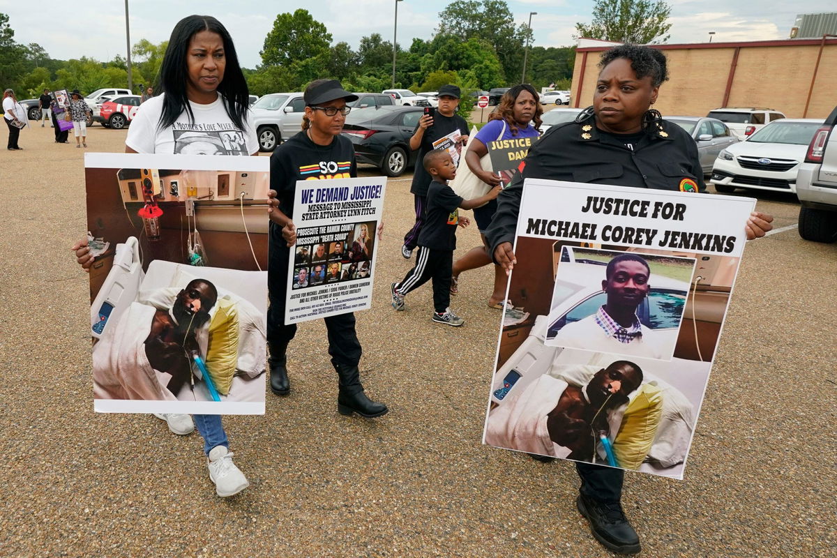 <i>Rogelio V. Solis/AP via CNN Newsource</i><br/>Activists march towards the Rankin County Sheriff's Office in Brandon