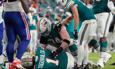 Miami Dolphins quarterback Tua Tagovailoa (1) lies on the field after suffering a concussion during the second half of an NFL football game against the Buffalo Bills