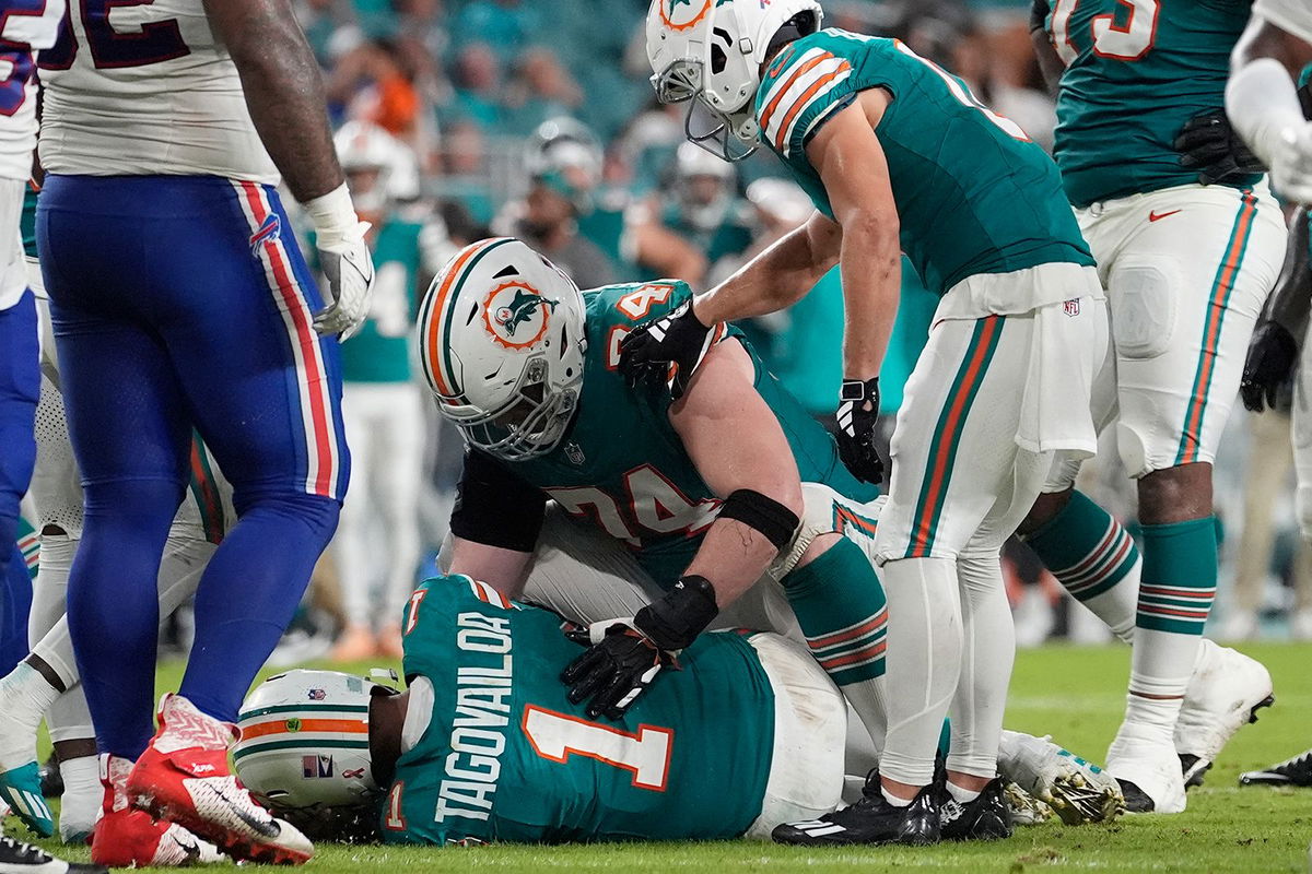 <i>Lynne Sladky/AP via CNN Newsource</i><br/>Miami Dolphins quarterback Tua Tagovailoa (1) lies on the field after suffering a concussion during the second half of an NFL football game against the Buffalo Bills