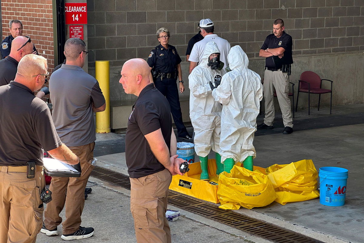 <i>Summer Ballentine/AP via CNN Newsource</i><br/>A hazmat crew from the National Guard's Civilian Support Team investigates after a suspicious package was delivered to election officials at the Missouri Secretary of State's Jefferson City