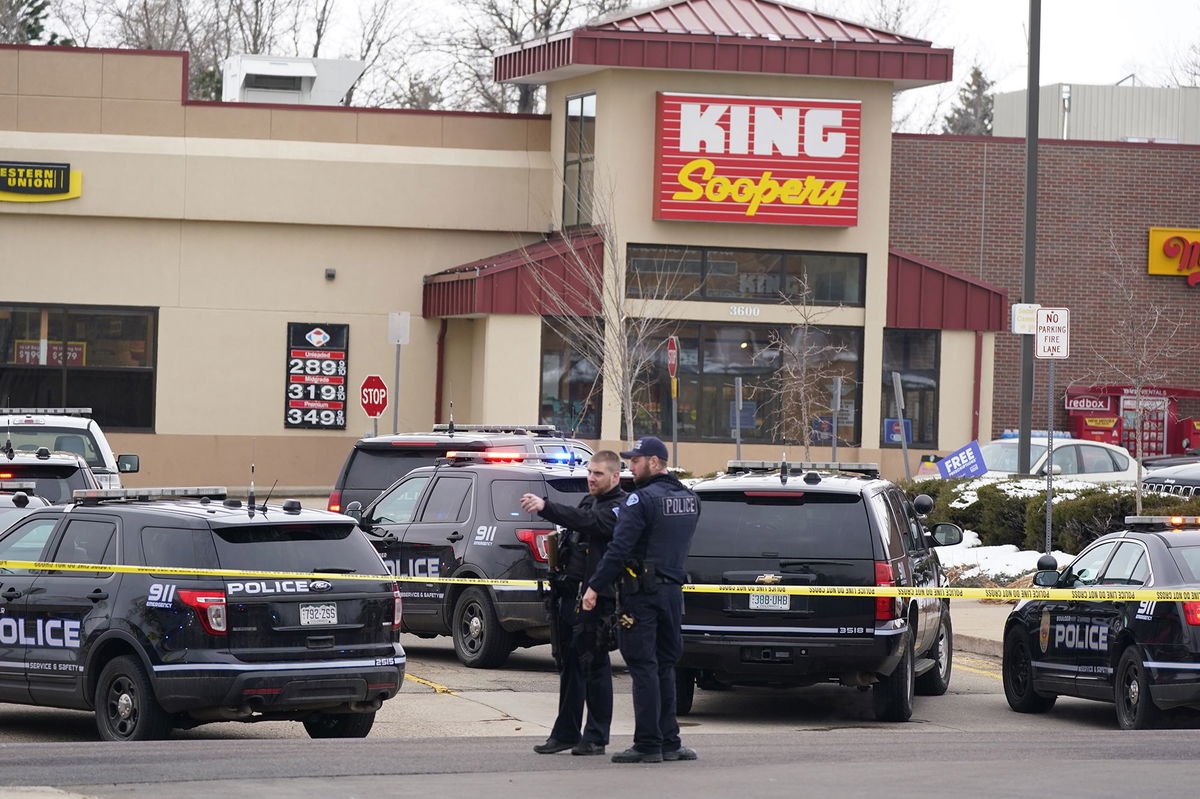 <i>David Zalubowski/AP via CNN Newsource</i><br/>Police work on the scene outside of a King Soopers grocery store where a shooting took place in March 2021 in Boulder