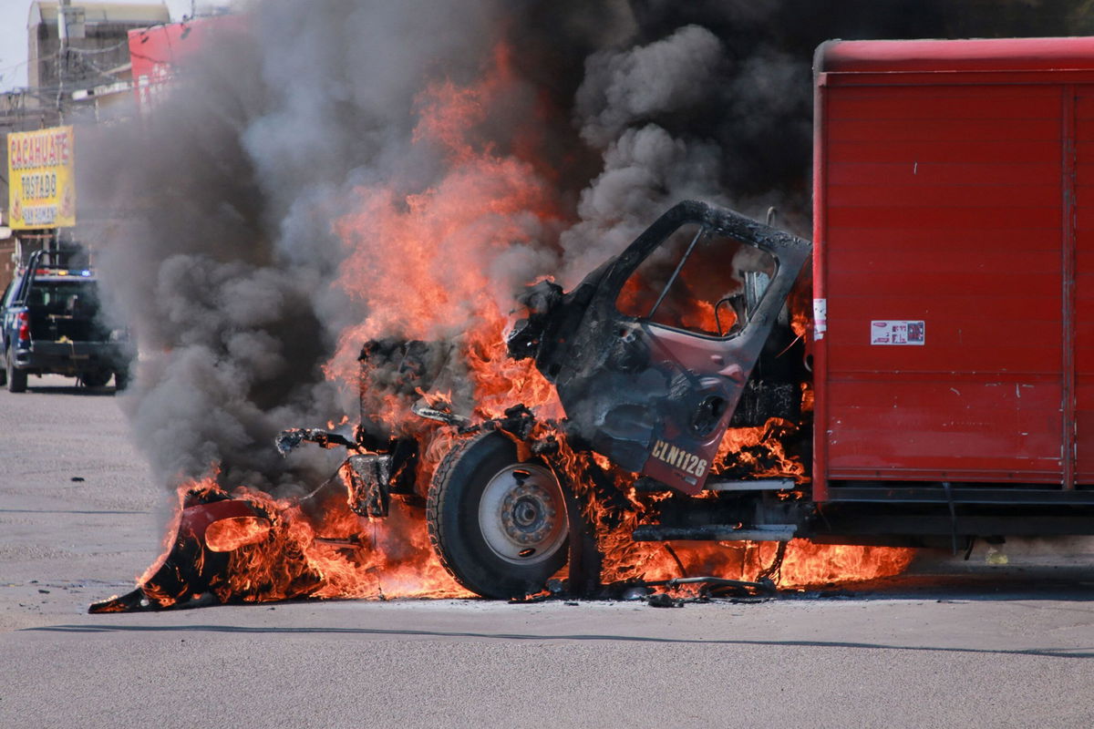 <i>Ivan Medina/AFP/Getty Images via CNN Newsource</i><br/>A truck on fire is seen on the streets of Culiacan