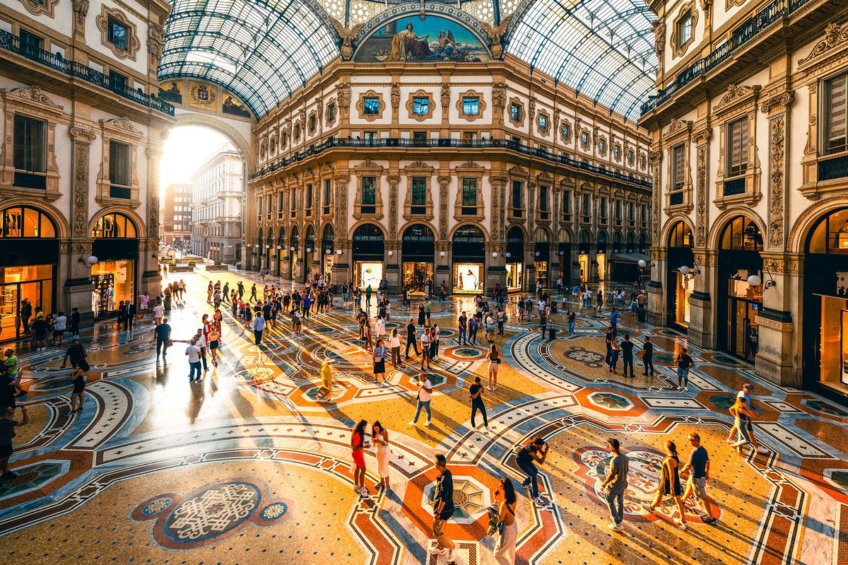 <i>Marco Bottigelli/Moment RF/Getty Images via CNN Newsource</i><br/>The sun sets in Milan as people stroll through Galleria Vittorio Emanuele II. Italian citizenship is especially sought after.