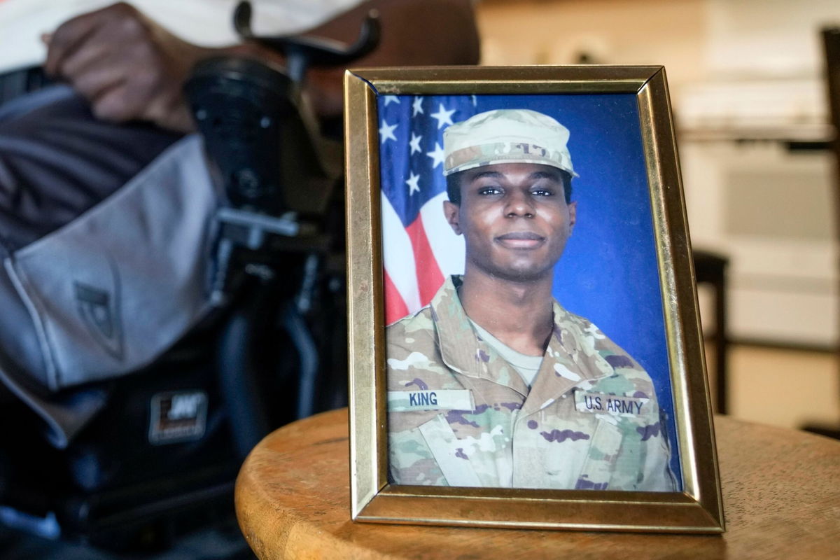 <i>Morry Gash/AP via CNN Newsource</i><br/>A portrait of American soldier Travis King is displayed as his grandfather