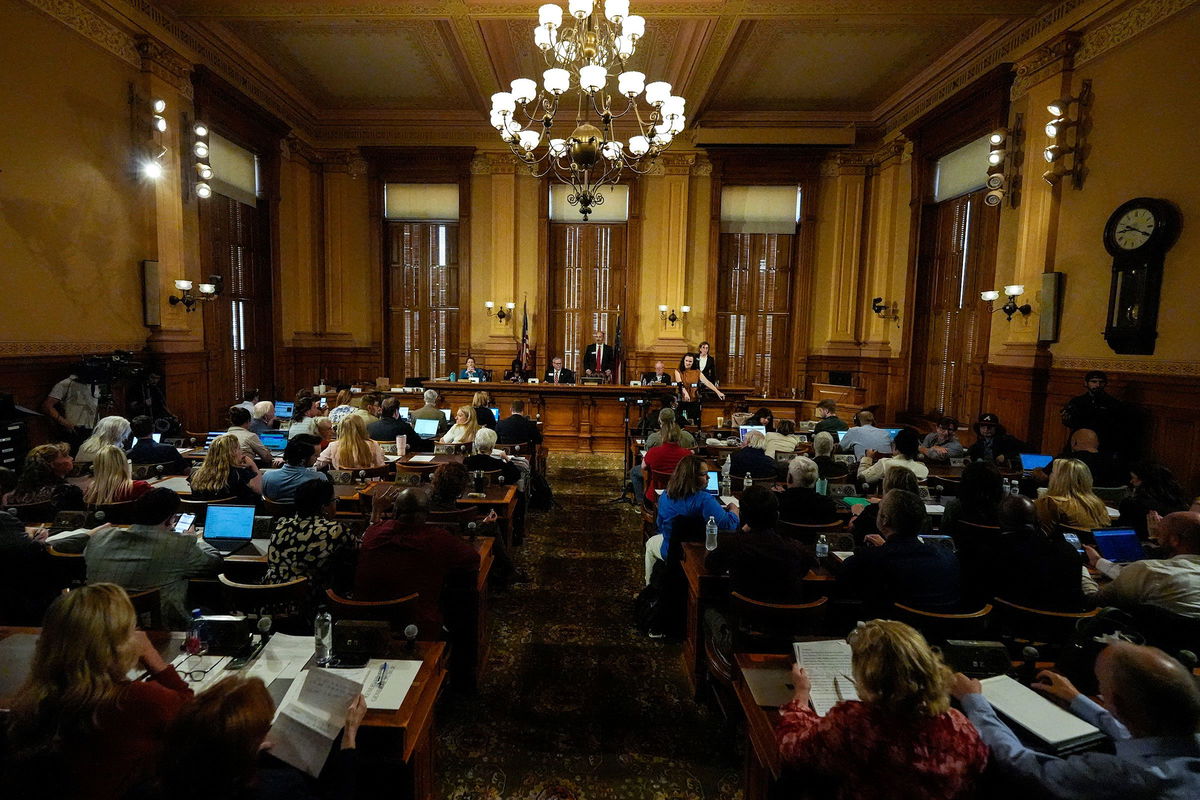 <i>Matt Slocum/AP via CNN Newsource</i><br />Election workers process mail-in and absentee ballots in West Chester