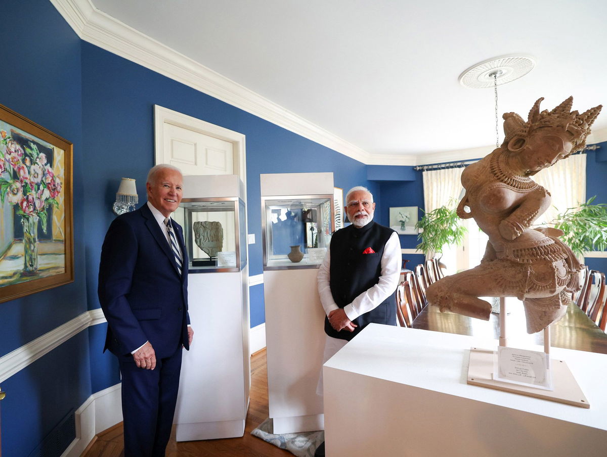 <i>Indian Press Information Bureau/Anadolu/Getty Images via CNN Newsource</i><br/>US President Joe Biden and Indian Prime Minister Narendra Modi pose in front of several artifacts that will be returned to India on September 21.