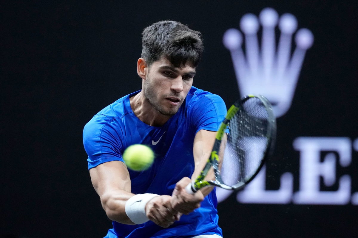 <i>Ebrahim Noroozi/AP via CNN Newsource</i><br/>Carlos Alcaraz lifts the Laver Cup after Europe's victory.