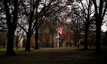 A United States flag flies on the campus of Tufts University in Medford