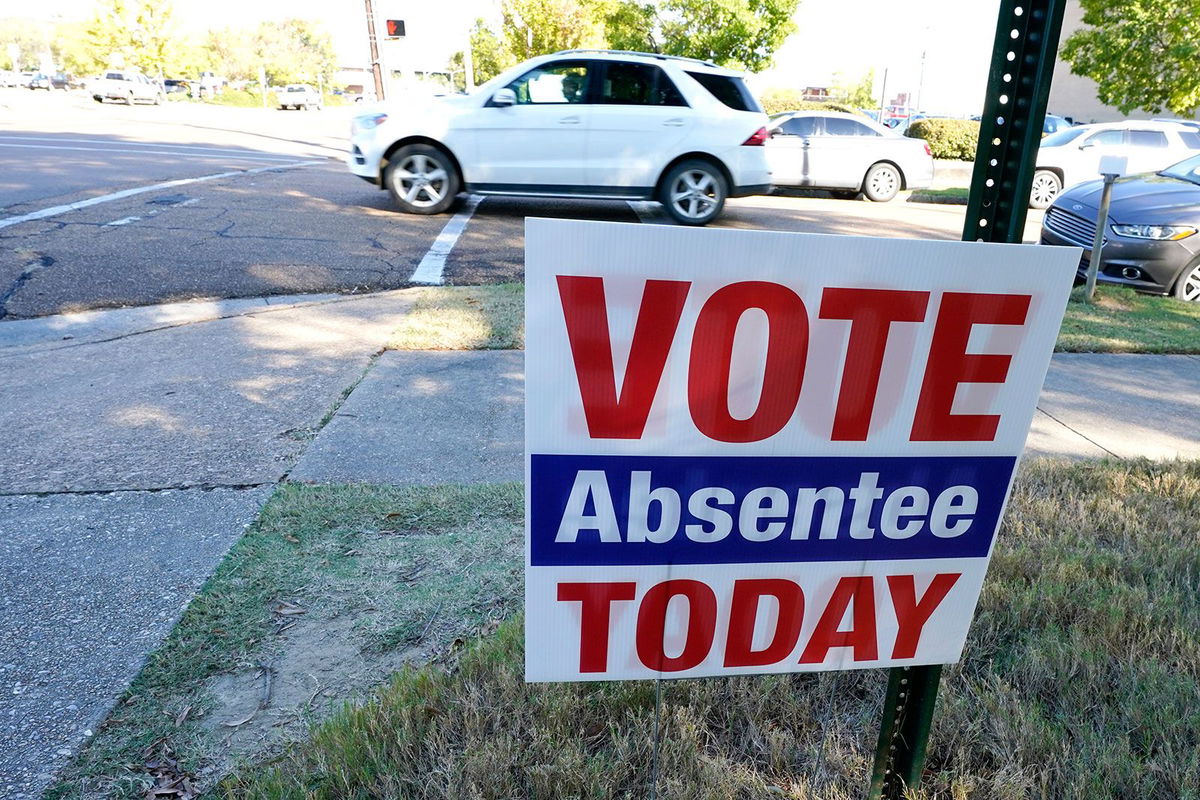 <i>Rogelio V. Solis/AP/File via CNN Newsource</i><br/>A sign encouraging people to vote absentee stands outside the Hinds County Courthouse in Jackson