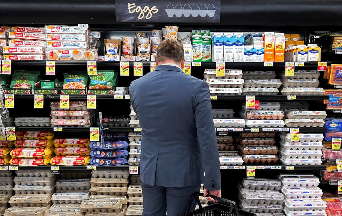 <i>Jim Vondruska/Reuters via CNN Newsource</i><br/>A man looks at eggs displayed at a supermarket in Chicago