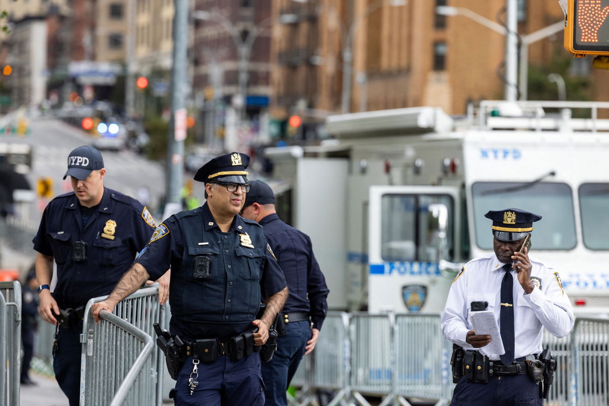 <i>Ali Khaligh/Middle East Images/AFP/Getty Images via CNN Newsource</i><br/>Police gather outside the United Nations in New York City