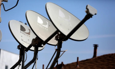 DirecTV satellite dishes are seen on an apartment roof in Los Angeles, California in this file photo. Jonathan Alcorn/Reuters