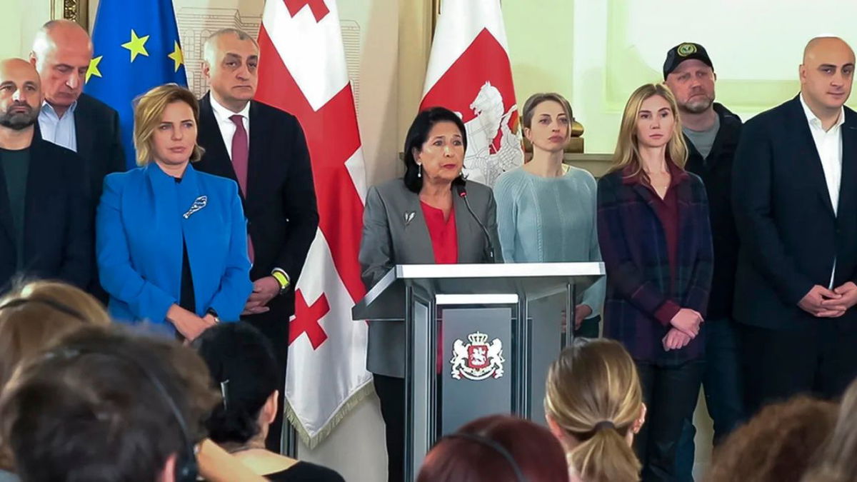 Georgian President Salome Zourabichvili, center, surrounded by opposition leaders, speaks to the media after the parliamentary election in Tbilisi, Georgia, on Oct. 27, 2024. Kostya Manenkov/AP