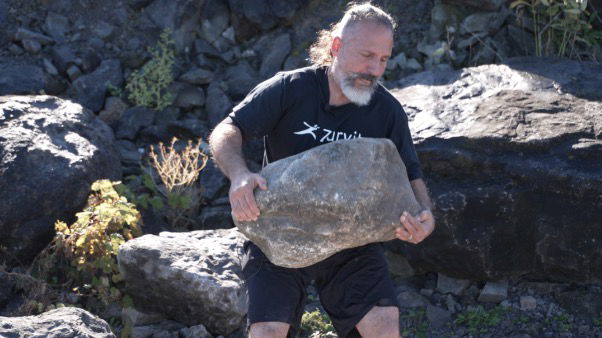 <i>WKBW via CNN Newsource</i><br/>This stone in Johnson's hands weighs roughly 200 pounds.