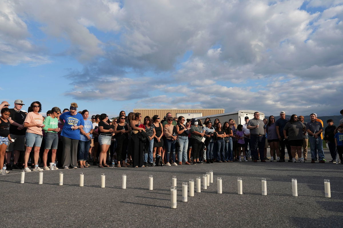 <i>Saul Young/News Sentinel/USA Today Network/Imagn Images via CNN Newsource</i><br/>Candles are set out in the shape of a cross where almost 200 people gathered for a candlelight vigil on Thursday for the Erwin