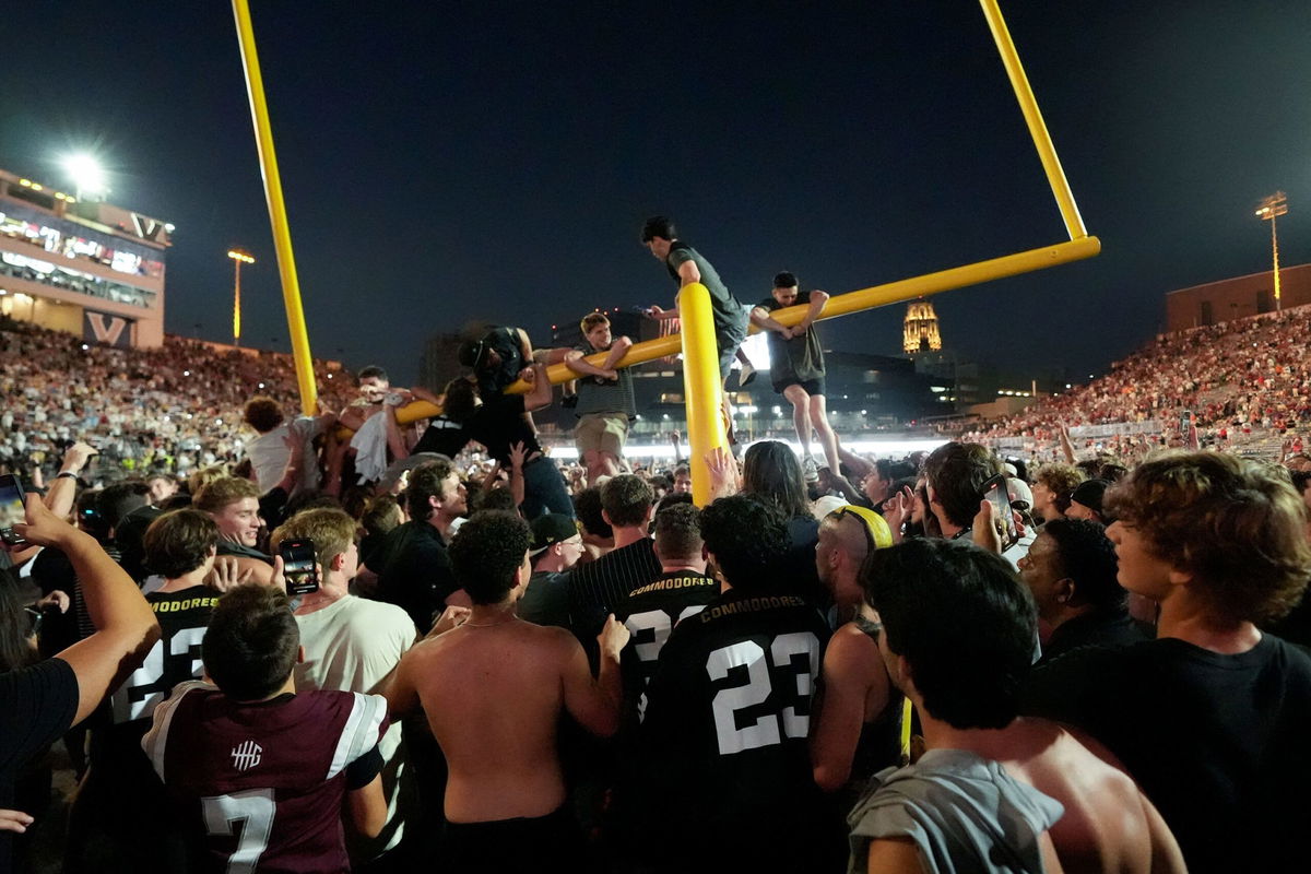 <i>Matthew Maxey/Icon Sportswire/Getty Images via CNN Newsource</i><br/>Vanderbilt Commodores players and fans celebrate following their win.