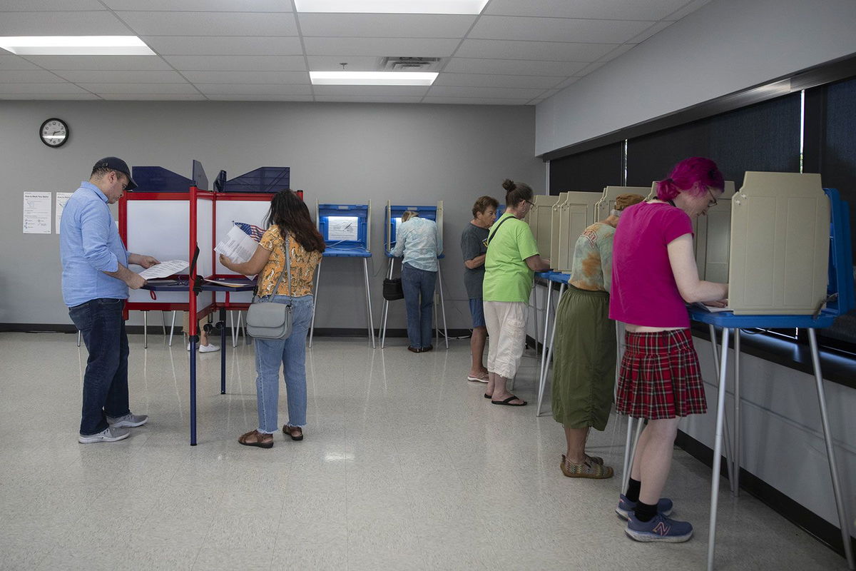 <i>Christopher Mark Juhn/Anadolu/Getty Images/File via CNN Newsource</i><br/>People arrive to cast their ballot during early voting in Minnesota on September 20.