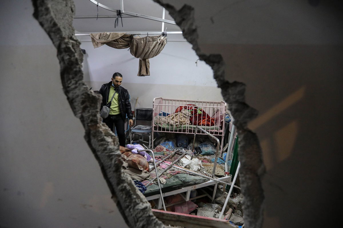 <i>Ahmad Hasaballah/Getty Images via CNN Newsource</i><br />People inspect the damage caused by an artillery shell that hit the maternity hospital inside the Nasser Medical Complex