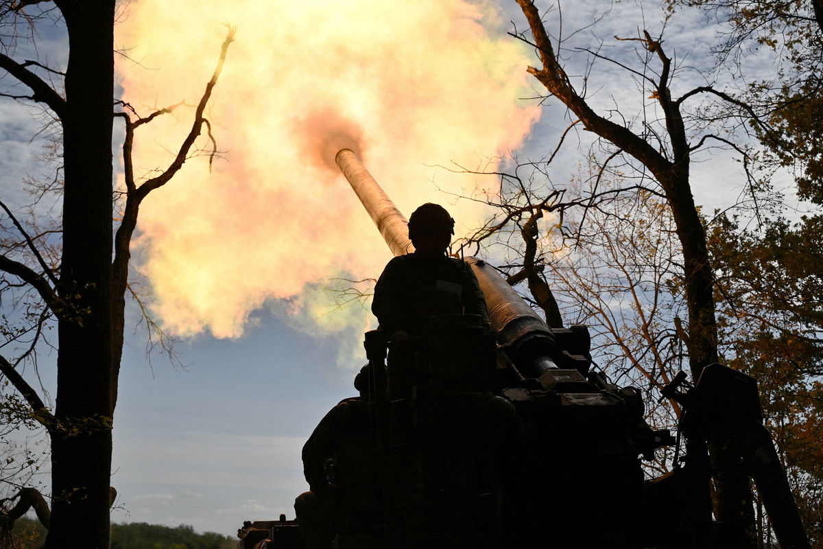 <i>Genya Savilov/AFP/Getty Images via CNN Newsource</i><br/>Ukrainian servicemen fire a self-propelled cannon towards Russian positions at a front line in the Donetsk region on September 27.