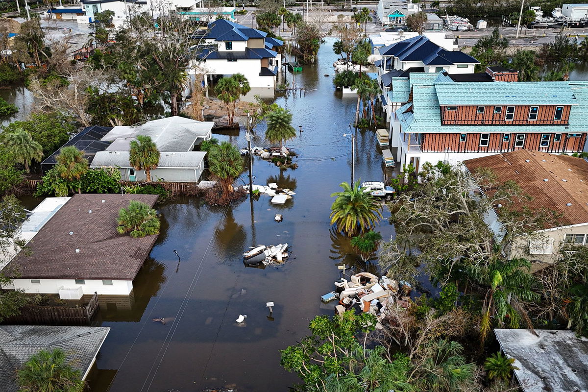 <i>Miguel J. Rodriguez Carrillo/AFP/Getty Images via CNN Newsource</i><br/>A drone image shows a flooded street due to Hurricane Milton in Siesta Key