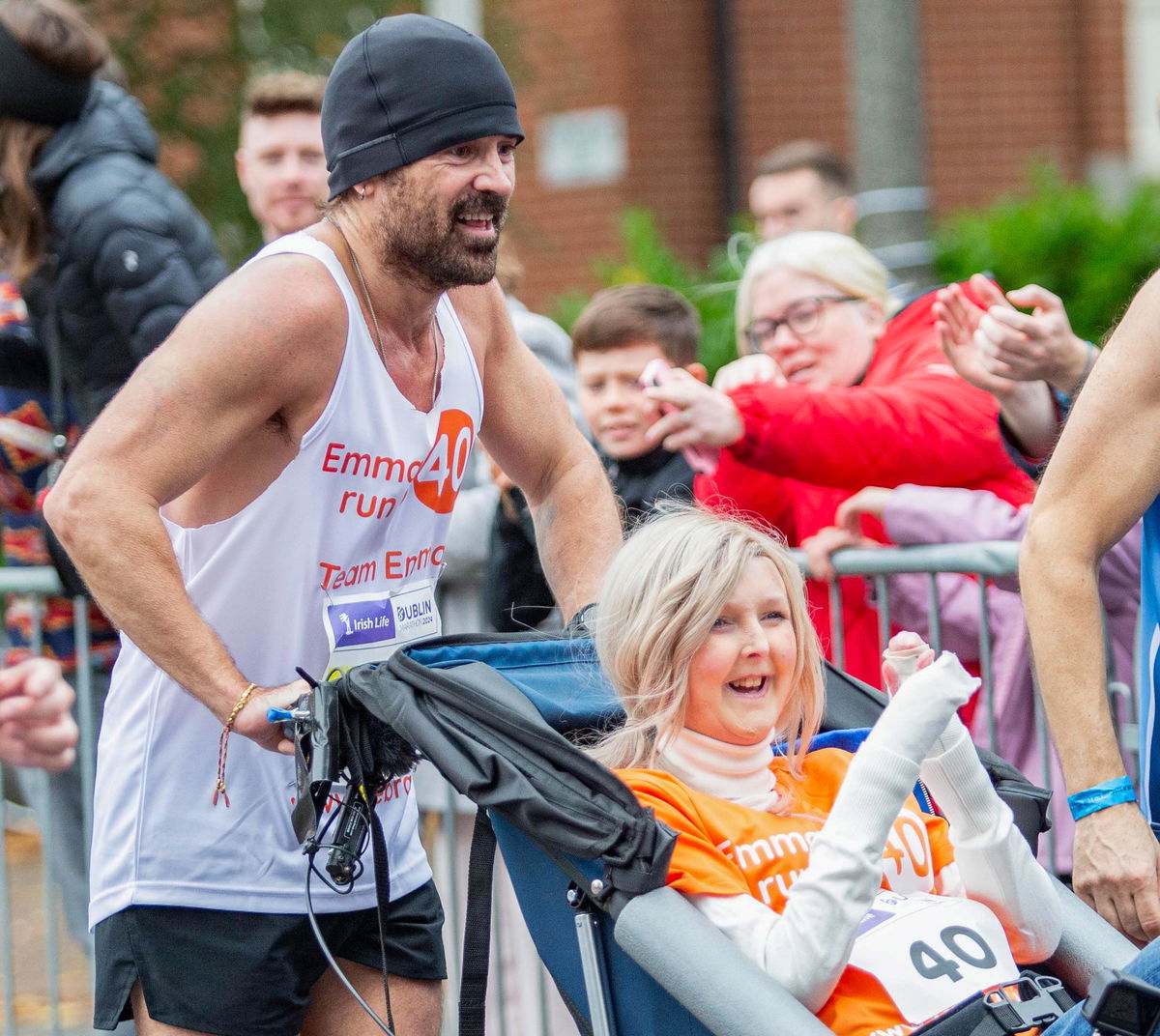 <i>Peter Morrison/AP via CNN Newsource</i><br/>Actor Colin Farrell ran the final 4 kilometers of the Irish Life Dublin Marathon 2024 while pushing close friend Emma Fogarty.