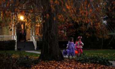 Children go trick-or-treating in the New York suburb of Upper Nyack