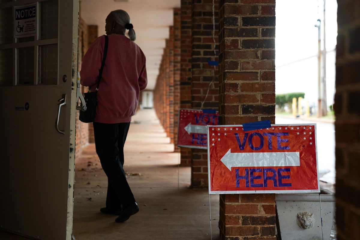 <i>Megan Varner/Getty Images via CNN Newsource</i><br/>People arrive to cast their votes at a polling location in Atlanta on October 15