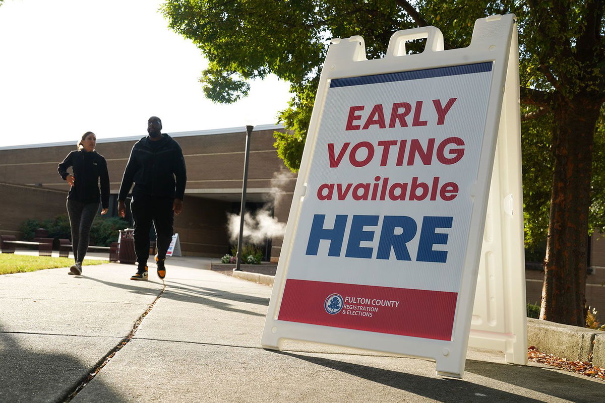 <i>Megan Varner/Getty Images via CNN Newsource</i><br/>Signs direct people where to go to cast their votes on the first day of early voting at Atlanta Metropolitan State College on October 15 in Atlanta