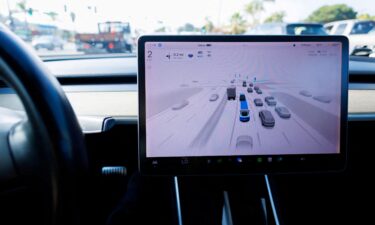 A Tesla Model 3 vehicle drives using FSD (Full Self-Driving) in Encinitas