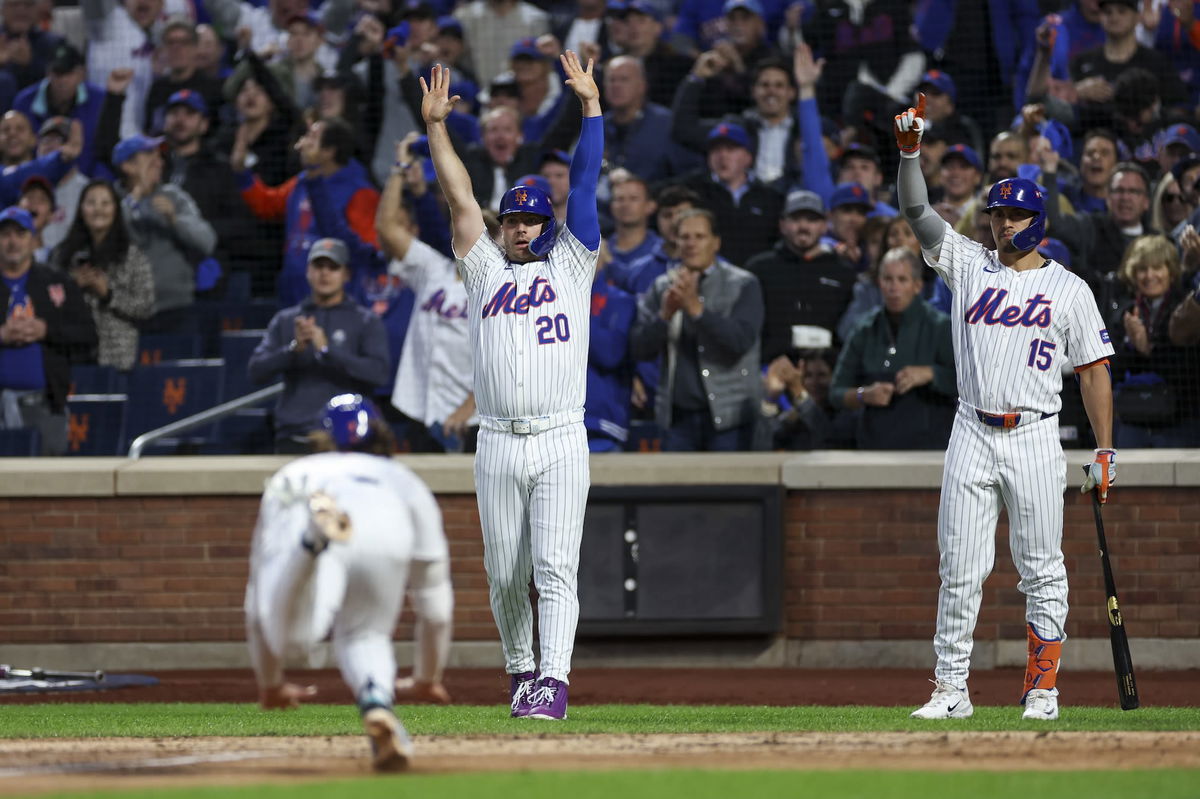 <i>Rob Tringali/MLB Photos/Getty Images via CNN Newsource</i><br/>New York Mets fan dressed as Grimace celebrates the team forcing a Game 6 in NLCS.