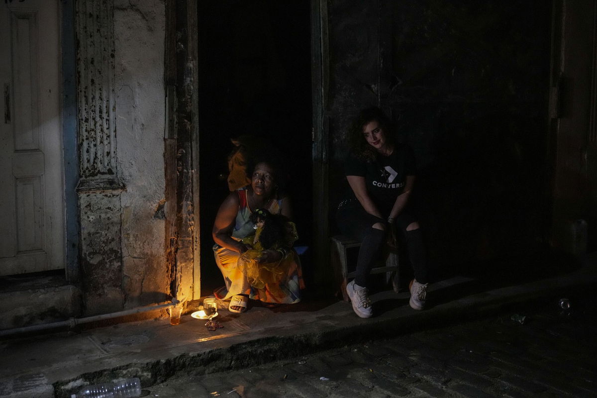 <i>Ramon Espinosa/AP via CNN Newsource</i><br />Residents pass the time during a blackout following the failure of a major power plant in Havana