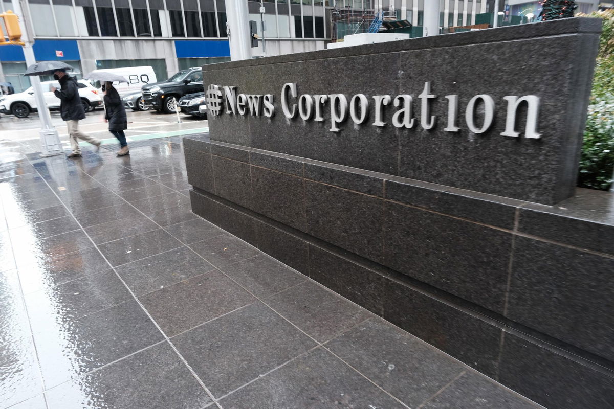 <i>Spencer Platt/Getty Images via CNN Newsource</i><br/>People walk past 1211 Avenue of the Americas the headquarters for News Corp on February 4